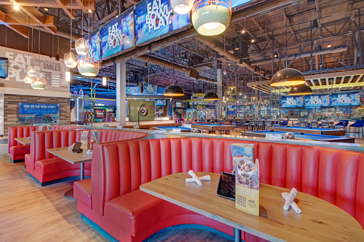 Restaurant interior with gaming and bar seating