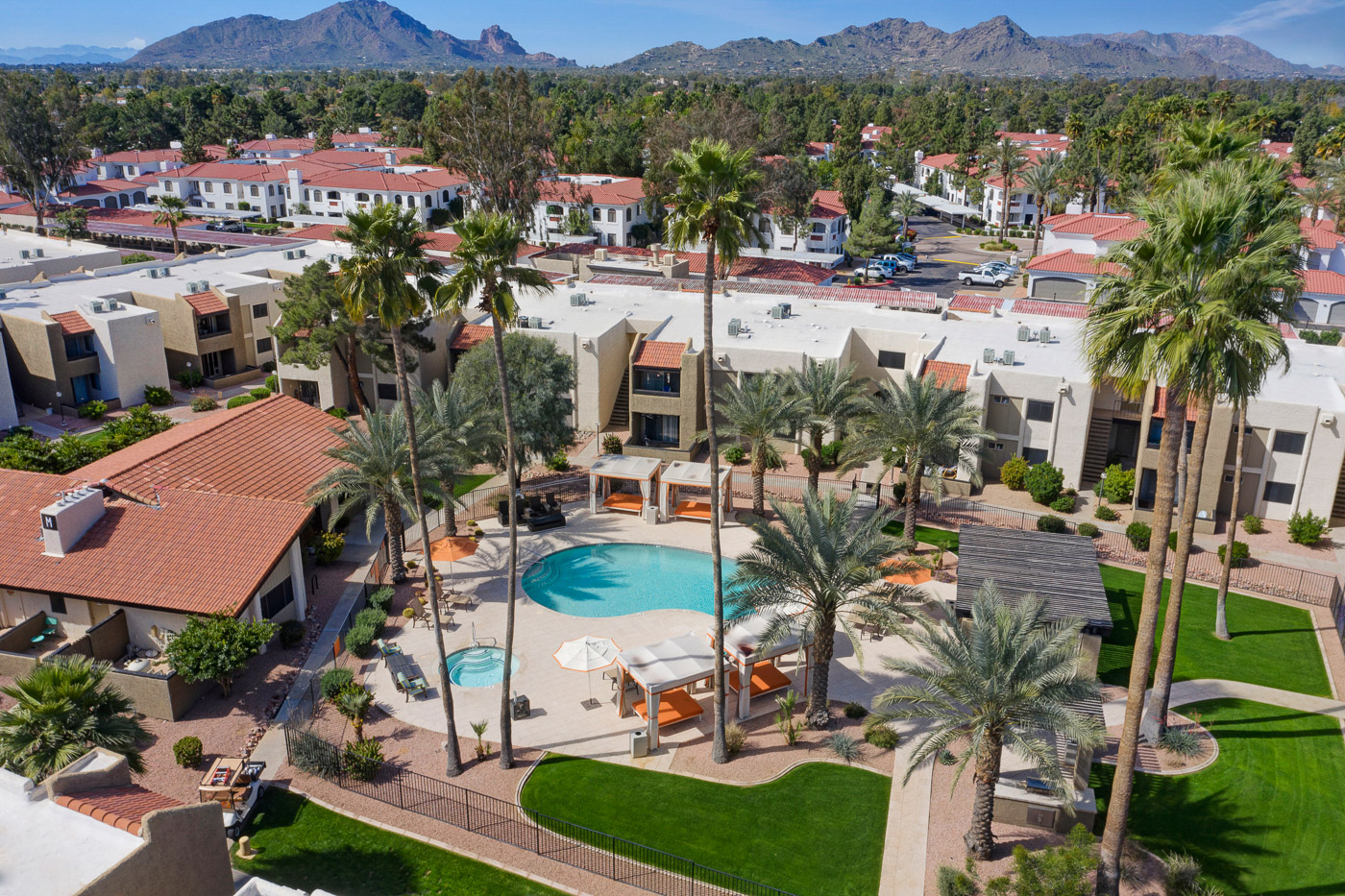 drone-apartment-resort-style-pool-palm-trees drone-apartment-resort-style-pool-palm-trees