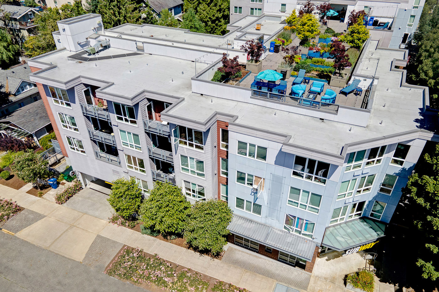Drone photography of apartment building rooftop and amenities