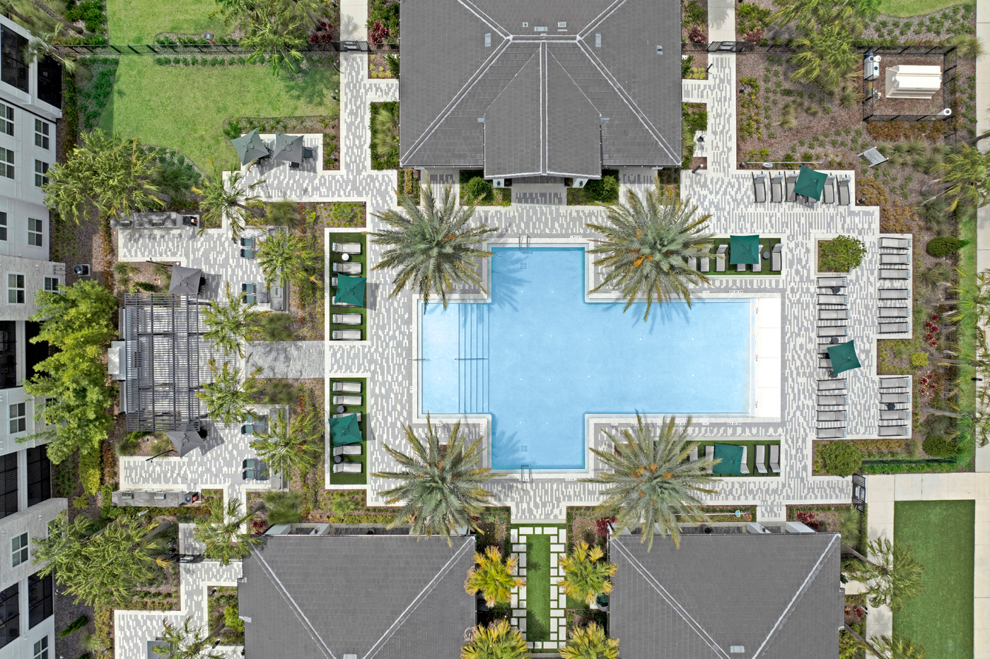 Drone photography of apartment pool and courtyard from above